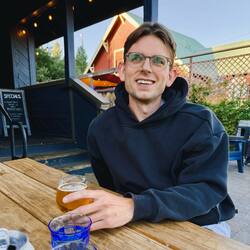 Joscha sitting at an outdoor table